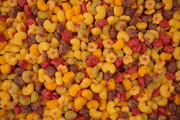 Sweet crunchy cornflakes as a background. Top view.