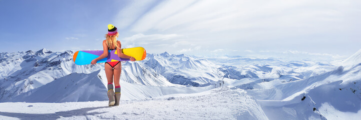 Woman with Snowboard on Mountain Wide Banner