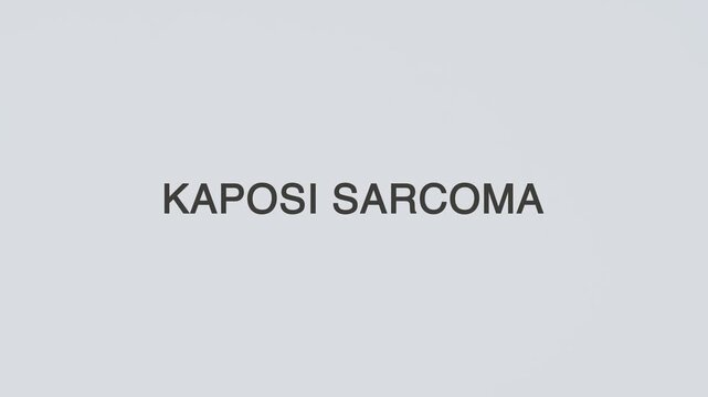 Hand holds stethoscope over the words &ldquo;Kaposi Sarcoma&rdquo; on white background, illustrating medical diagnosis, patient care, oncology evaluation, and professional healthcare assessment