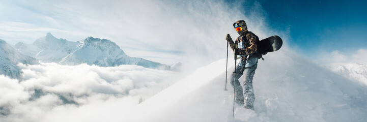 Snowboarder on Mountain Peak Wide Banner