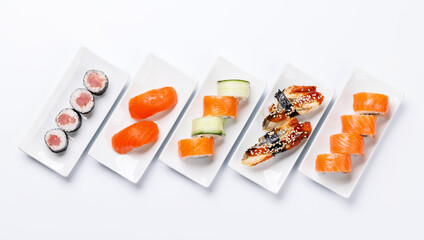 Assorted sushi and maki rolls beautifully arranged on plates