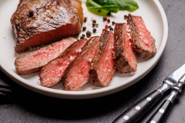 A perfectly cooked sliced striploin steak with a juicy, tender texture
