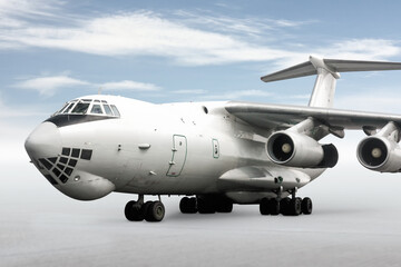 Obraz premium White wide body transport cargo aircraft isolated on bright background with sky