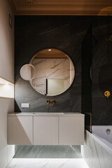 Modern bathroom design with elegant marble finishes and stylish fixtures in a contemporary setting