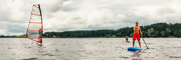 Water Sports Enthusiasts on Lake Wide Banner