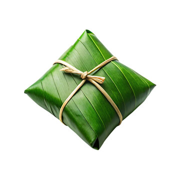 Square shaped food parcel wrapped in green banana leaf and tied with twine isolated on transparent background