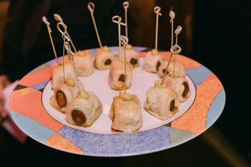Delicious hors d'oeuvres served on decorative platter at evening event