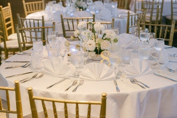 Elegant dining table setup with floral centerpiece for a formal event during evening celebration