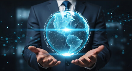 A business person holding a glowing digital Earth, representing global technology and connection.