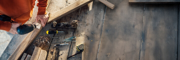 Carpentry Tools on Wooden Surface with Copy Space Wide Banner