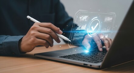 Person s hands interacting with futuristic digital interface displayed on laptop screen with glowing data