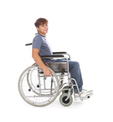 Smiling teenage boy in wheelchair on white background