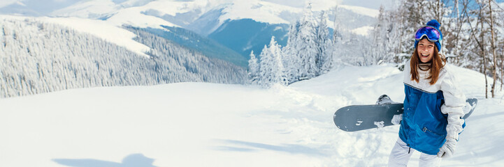 Fototapeta premium Snowboarder Smiling in Winter Landscape Wide Banner
