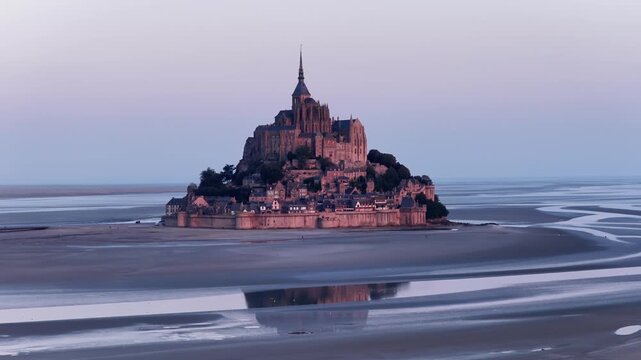Stunning aerial view showcasing Abbaye du Mont-Saint-Michel at twilight in Normandy, France