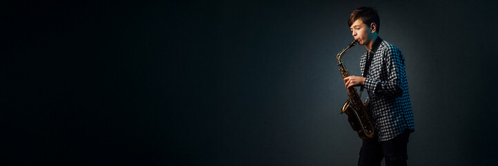 Wide Banner of Young Musician Playing Saxophone with Copy Space