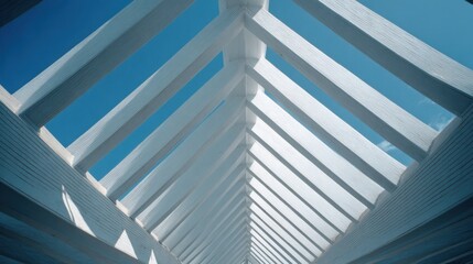 Architectural Perspective of White Wooden Roof Structure Against Clear Blue Sky