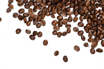 a pile of coffee beans on a white surface