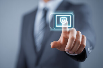 Executive man in formal suit touching augmented reality display with holographic credit card icon and secure digital payment shield.jpeg