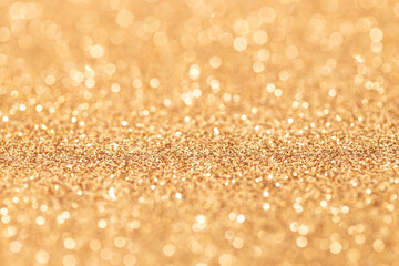 Gold glitter abstract background texture. Full frame. Selective focus