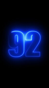 Illuminated blue neon number 92 on a black background ninety two glowing
