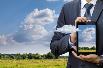 Businessman presenting cloud tech outside