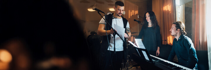 Musicians Collaborating in Studio Wide Banner