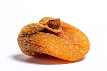 a dried apricot on a white surface