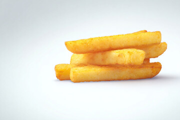 a pile of french fries sitting on top of a white surface