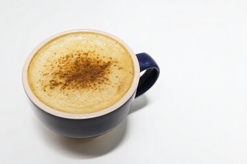 a cup of coffee with a brown substance on top