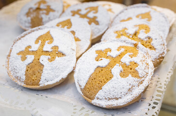 Group of small Tarta de Santiago on bakery store window of Santiago de Compostela, Spain. Sweet pie, Typical dessert of Galicia cuisine