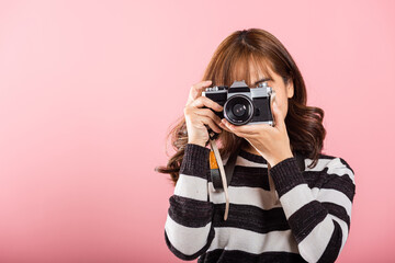 Attractive energetic happy Asian portrait beautiful young woman smiling photographer taking a...