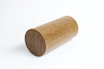 a wooden cylinder on a white surface