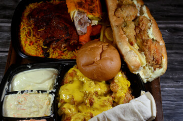 Meal of fast food of chicken meals of Crispy fried chicken and French fries with melted Cheddar,...