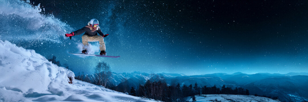 Snowboarder Jumping Under Starry Sky Wide Banner