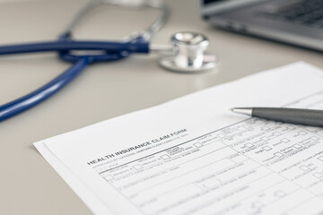 Health Insurance claim form on doctor desk