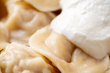 Pelmeni Russian national kitchen. Boiled dumplings with beef. Selective focus. Shallow depth of...