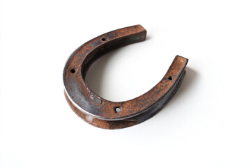 a horseshoe shaped object on a white surface