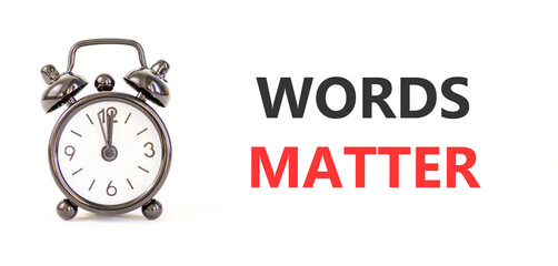 Words matter symbol. Concept word Words matter on beautiful white paper. Beautiful black alarm...