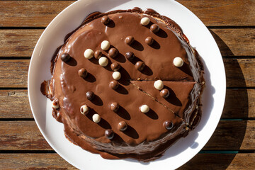 Homemade chocolate tart topped whit chocolate balls