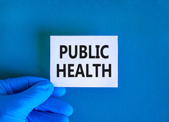 Public health symbol. Concept words Public health on beautiful white card. Doctor's hand in blue...