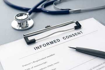 Informed Consent form and stethoscope on desk