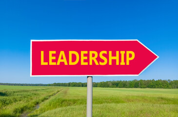 Leadership symbol. Concept word Leadership on beautiful red road sign. Beautiful blue sky green grass and forest peaceful nature background. Business leadership concept. Copy space.