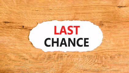 Last chance symbol. Concept word Last chance on beautiful white paper. Beautiful wooden paper...
