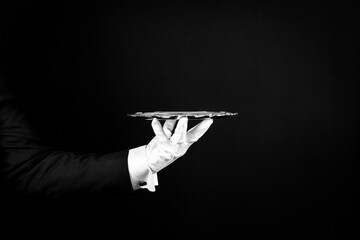 Isolated Image of White Gloved Hand Holding Serving Tray. Butler At Your Service.