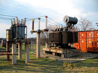 Old electrical transformer and dead tank oil circuit breakers 35 kV.