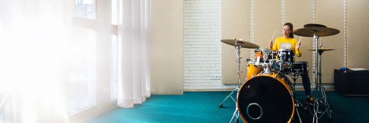 Fototapeta premium Drummer in Studio Wide Banner with Copy Space
