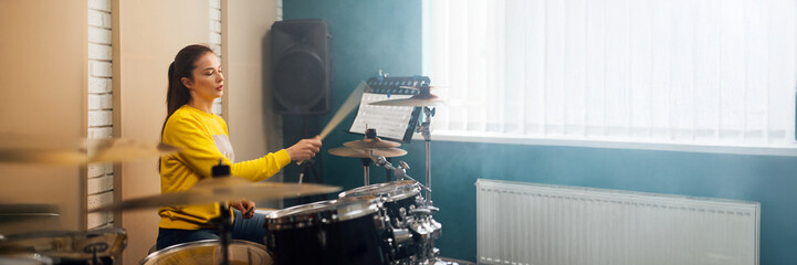Woman Drumming in Studio Wide Banner with Copy Space