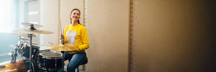 Smiling Drummer in Studio Wide Banner with Copy Space