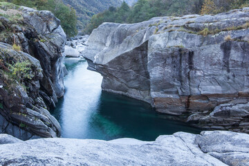 Crystal clear turquoise water of the Verzasca River in the valley of the same name, Ticino,...