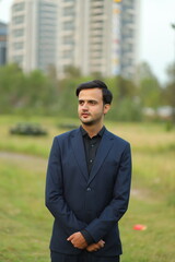 Thoughtful Portrait of a Modern Gentleman: A sophisticated gentleman, dressed in a tailored suit,...